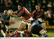 28 November 2003; David Wallace, Munster, is tackled by Cardiff Blues' Heino Senekal. Celtic League, Munster v Cardiff Blues, Musgrave Park, Cork. Picture credit; Matt Browne / SPORTSFILE *EDI*