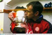 28 November 2003; Shelbourne manager Pat Fenlon kisses the trophy after winning the eircom League Premier Division title. eircom league Premier Division, Shamrock Rovers v Shelbourne, Tolka Park, Dublin. Soccer. Picture credit; David Maher / SPORTSFILE *EDI*