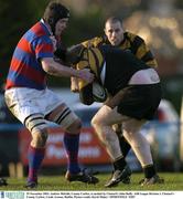 29 November 2003; Andrew Melville, County Carlow, is tackled by Clontarf's John Duffy. AIB League Division 1, Clontarf v County Carlow, Castle Avenue, Dublin. Picture credit; David Maher / SPORTSFILE *EDI*