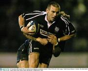 29 November 2003; Gareth Morris, Neath-Swansea Ospreys, is tackled by Leinster's Brian O'Driscoll. Celtic League,  Neath-Swansea Ospreys v Leinster, The John Smith's Gnoll, Neath, Wales. Picture credit; Matt Browne / SPORTSFILE *EDI*