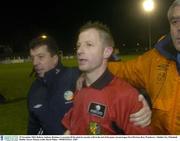 29 November 2003; Referee Anthony Buttimer is escorted off the pitch by security staff at the end of the game. eircom league First Division, Bray Wanderers v Dublin City, Whitehall, Dublin. Soccer. Picture credit; David Maher / SPORTSFILE *EDI*