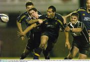 29 November 2003; Felipe Contebomi, Leinster, is tackled by Neath-Swansea Ospreys' Shane Williams, left, and Andy Willams. Celtic League,  Neath-Swansea Ospreys v Leinster, The John Smith's Gnoll, Neath, Wales. Picture credit; Matt Browne / SPORTSFILE *EDI*