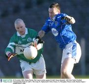 30 November 2003; Fintan Martin, The Loup, in action against St Gall's Simon Kennedy. AIB Ulster Senior Football Championship Final, St. Gall's v The Loup, St. Tighearnach's Park, Clones, Co. Monaghan. Picture credit; Damien Eagers / SPORTSFILE *EDI*