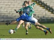 30 November 2003; Padraig O'Kane, The Loup, in action against St Gall's Sean Kelly. AIB Ulster Senior Football Championship Final, St. Gall's v The Loup, St. Tighearnach's Park, Clones, Co. Monaghan. Picture credit; Damien Eagers / SPORTSFILE *EDI*