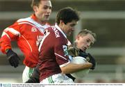 30 November 2003; Brian Laffey, Caltra, in action against Curry's Brian Giblin, left, and goalkeeper Jeffrey Durcank. AIB Connacht Senior Football Championship Final, Caltra v Curry, Pearse Stadium, Galway. Picture credit; David Maher / SPORTSFILE *EDI*