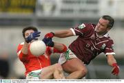 30 November 2003; Oliver Hennelly, Caltra, in action against Curry's Kevin Giblin. AIB Connacht Senior Football Championship Final, Caltra v Curry, Pearse Stadium, Galway. Picture credit; David Maher / SPORTSFILE *EDI*