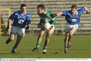 30 November 2003; Paul McFlynn, The Loup, in action against St Gall's Sean Kelly, left. AIB Ulster Senior Football Championship Final, St. Gall's v The Loup, St. Tighearnach's Park, Clones, Co. Monaghan. Picture credit; Damien Eagers / SPORTSFILE *EDI*