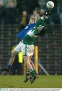 30 November 2003; Ciaran McGourty, St. Gall's, in action against The Loup's John Young. AIB Ulster Senior Football Championship Final, St. Gall's v The Loup, St. Tighearnach's Park, Clones, Co. Monaghan. Picture credit; Damien Eagers / SPORTSFILE *EDI*