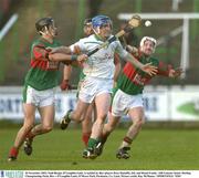 30 November 2003; Niall Bergin, O'Loughlin Gaels, is tackled by Birr players Rory Hanniffy, left, and Donal Franks. AIB Leinster Senior Hurling Championship Final, Birr v O'Loughlin Gaels, O'Moore Park, Portlaoise, Co. Laois. Picture credit; Ray McManus / SPORTSFILE *EDI*