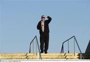 30 November 2003; One of the 6726 patrons at the game shades his eyes from the sun. AIB Leinster Senior Hurling Championship Final, Birr v O'Loughlin Gaels, O'Moore Park, Portlaoise, Co. Laois. Picture credit; Ray McManus / SPORTSFILE *EDI*