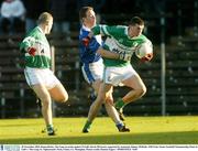 30 November 2003; Ronan Rocks, The Loup, in action against St Gall's Kevin McGourty supported by teammate Johnny McBride. AIB Ulster Senior Football Championship Final, St. Gall's v The Loup, St. Tighearnach's Park, Clones, Co. Monaghan. Picture credit; Damien Eagers / SPORTSFILE *EDI*