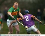 6 December 2003; Mike Morrissey, Newtownshandrunm, in action against Fr. Murphy's Tom Sims. AIB All-Ireland  Club Senior Hurling Championship Quarter-Final, Fr. Murphy's v Newtownshandrum, Emerald Gaelic Grounds, Ruislip, London. Picture credit; Pat Murphy / SPORTSFILE *EDI*