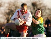 7 December 2003; Dara O'Cinneide, An Ghaeltacht, in action against Tara's Adrian O'Grady. AIB All-Ireland Club Senior Football Championship Quarter-Final, Tara v An Ghaeltacht, Emerald Gaelic Grounds, Ruislip, London. Picture credit; Pat Murphy / SPORTSFILE *EDI*