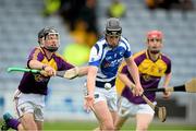 23 June 2013; Ronan Delahunty, Laois, in action against Jake Firman, Wexford. Electric Ireland Leinster GAA Hurling Minor Championship Semi-Final, Laois v Wexford, O'Moore Park, Portlaoise, Co. Laois. Picture credit: David Maher / SPORTSFILE
