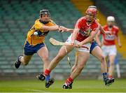 23 June 2013; Colm Casey, Cork, scores his side's first goal despite the best efforts of Darragh Corry, left, and Kilian Ryan, Clare. Munster GAA Hurling Intermediate Championship, Semi-Final, Cork v Clare, Gaelic Grounds, Limerick. Picture credit: Brendan Moran / SPORTSFILE