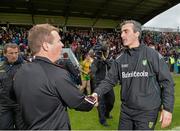 23 June 2013; Donegal manager Jim McGuinness shakes hands with Down manager James McCartan, left, after the match. Ulster GAA Football Senior Championship Semi-Final, Donegal v Down, Kingspan Breffni Park, Cavan. Picture credit: Brian Lawless / SPORTSFILE