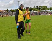 23 June 2013; Donegal's Michael Murphy leaves the pitch with Dr Charlie McManus, Donegal team doctor, after the match. Ulster GAA Football Senior Championship Semi-Final, Donegal v Down, Kingspan Breffni Park, Cavan. Picture credit: Brian Lawless / SPORTSFILE