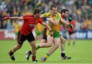 23 June 2013; Michael Murphy, Donegal, in action against Peter Turley, left, and Kevin McKernan, Down. Ulster GAA Football Senior Championship Semi-Final, Donegal v Down, Kingspan Breffni Park, Cavan. Picture credit: Brian Lawless / SPORTSFILE