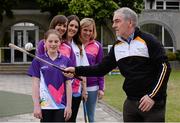 24 June 2013; Tyrone manager Mickey Harte demonstrates his hurling skills infront of Maria Walsh, Una Kelly, Sarah Marie Carthy and Anne McAreavey during the Dublin launch of Michaela Girls Summer Camp 2013. St Louis Infant School, Williams Park, Rathmines, Dublin. Picture credit: Ray McManus / SPORTSFILE