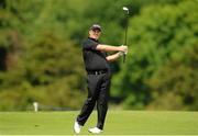 25 June 2013; Shane Lowry watches his second shot to the 2nd green during the practice day of the Irish Open Golf Championship 2013. Carton House, Maynooth, Co. Kildare. Picture credit: David Maher / SPORTSFILE