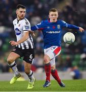 8 November 2019; Jordan Flores of Dundalk in action against Shayne Lavery of Linfield during the Unite the Union Champions Cup first leg match between Linfield and Dundalk at the National Football Stadium at Windsor Park in Belfast. Photo by Oliver McVeigh/Sportsfile