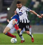 8 November 2019; Dean Jarvis of Dundalk in action against Stephen Fallon of Linfield during the Unite the Union Champions Cup first leg match between Linfield and Dundalk at the National Football Stadium at Windsor Park in Belfast. Photo by Oliver McVeigh/Sportsfile