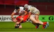 9 November 2019; Chris Farrell of Munster is tackled by Jacob Stockdale and Luke Marshall of Ulster during the Guinness PRO14 Round 6 match between Munster and Ulster at Thomond Park in Limerick. Photo by Diarmuid Greene/Sportsfile