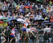 5 May 2019; Ponchos and umbrellas in a thronged Gaelic Park – it has to be the Mayo Movement. Estimates vary of the number of Mayo fans who travelled to New York for their opening championship match but it’s definitely more than the 6,000 capacity of the stadium. Neither the familiar wet weather nor the home team could dampen their spirits. Photo by Piaras Ó Mídheach/Sportsfile. This image may be reproduced free of charge when used in conjunction with a review of the book &quot;A Season of Sundays 2019&quot;. All other usage © SPORTSFILE