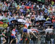 5 May 2019; Ponchos and umbrellas in a thronged Gaelic Park – it has to be the Mayo Movement. Estimates vary of the number of Mayo fans who travelled to New York for their opening championship match but it’s definitely more than the 6,000 capacity of the stadium. Neither the familiar wet weather nor the home team could dampen their spirits. Photo by Piaras Ó Mídheach/Sportsfile. This image may be reproduced free of charge when used in conjunction with a review of the book &quot;A Season of Sundays 2019&quot;. All other usage © SPORTSFILE