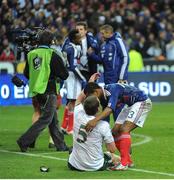 18 November 2009; Richard Dunne, Republic of Ireland, with Patrice Evra, France, after the game. FIFA 2010 World Cup Qualifying Play-off 2nd Leg, Republic of Ireland v France, Stade de France, Saint-Denis, Paris, France. Picture credit: Stephen McCarthy / SPORTSFILE