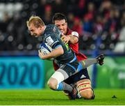 16 November 2019; Luke Price of Ospreys is tackled by Jean Kleyn of Munster during the Heineken Champions Cup Pool 4 Round 1 match between Ospreys and Munster at Liberty Stadium in Swansea, Wales. Photo by Seb Daly/Sportsfile