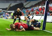 16 November 2019; Keith Earls of Munster dives over to score his side's second try, despite the tackle of Hanno Dirksen of Ospreys, during the Heineken Champions Cup Pool 4 Round 1 match between Ospreys and Munster at Liberty Stadium in Swansea, Wales. Photo by Seb Daly/Sportsfile