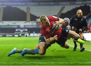 16 November 2019; Keith Earls of Munster dives over to score his side's second try, despite the tackle of Hanno Dirksen of Ospreys, during the Heineken Champions Cup Pool 4 Round 1 match between Ospreys and Munster at Liberty Stadium in Swansea, Wales. Photo by Seb Daly/Sportsfile