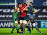 16 November 2019; CJ Stander of Munster is tackled by Bradley Davies, right, and Olly Cracknell of Ospreys during the Heineken Champions Cup Pool 4 Round 1 match between Ospreys and Munster at Liberty Stadium in Swansea, Wales. Photo by Seb Daly/Sportsfile