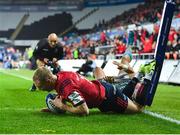 16 November 2019; Keith Earls of Munster dives over to score his side's second try, despite the tackle of Hanno Dirksen of Ospreys, during the Heineken Champions Cup Pool 4 Round 1 match between Ospreys and Munster at Liberty Stadium in Swansea, Wales. Photo by Seb Daly/Sportsfile