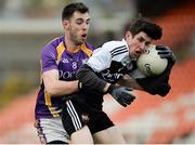 17 November 2019; Eugene Branagan of Kilcoo in action against  Ryan Jones of Derrygonnelly during the AIB Ulster GAA Football Senior Club Championship semi-final match between Kilcoo and Derrygonnelly at the Athletic Grounds in Armagh. Photo by Oliver McVeigh/Sportsfile