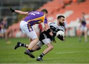 17 November 2019; Conor Laverty of Kilcoo in action against  Jack Love of Derrygonnelly during the AIB Ulster GAA Football Senior Club Championship semi-final match between Kilcoo and Derrygonnelly at the Athletic Grounds in Armagh. Photo by Oliver McVeigh/Sportsfile