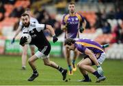 17 November 2019; Conor Laverty of Kilcoo in action against Tiernan Daly of Derrygonnelly during the AIB Ulster GAA Football Senior Club Championship semi-final match between Kilcoo and Derrygonnelly at the Athletic Grounds in Armagh. Photo by Oliver McVeigh/Sportsfile