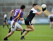 17 November 2019; Anthony Morgan of Kilcoo in action against Eamon McHugh of Derrygonnelly during the AIB Ulster GAA Football Senior Club Championship semi-final match between Kilcoo and Derrygonnelly at the Athletic Grounds in Armagh. Photo by Oliver McVeigh/Sportsfile