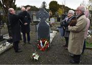21 November 2019;  Monsignor Eoin Thynne blesses the grave of Patrick O’Dowd alongside members of the deceased's family during the unveiling of headstones on the graves of Jerome O’Leary, 10, Michael Feery, 40, and Patrick O’Dowd, 57, who are among the 14 people killed at Croke Park on this day 99 years ago on what became known as Bloody Sunday. These unveilings complete the list of seven Bloody Sunday victims who until recently had all been buried in unmarked graves at different locations at Glasnevin Cemetery in Dublin. Photo by Matt Browne/Sportsfile