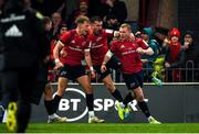 23 November 2019; Keith Earls of Munster, right, is congratulated by team-mates Mike Haley and JJ Hanrahan after scoring his side's first try during the Heineken Champions Cup Pool 4 Round 2 match between Munster and Racing 92 at Thomond Park in Limerick. Photo by Diarmuid Greene/Sportsfile