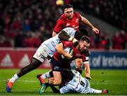 23 November 2019; JJ Hanrahan of Munster is tackled by Cedate Gomes Sa, left, and Teddy Iribaren of Racing 92 during the Heineken Champions Cup Pool 4 Round 2 match between Munster and Racing 92 at Thomond Park in Limerick. Photo by Brendan Moran/Sportsfile