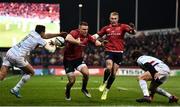 23 November 2019; Andrew Conway of Munster is tackled by Juan Imhoff, left, and Teddy Iribaren of Racing 92 during the Heineken Champions Cup Pool 4 Round 2 match between Munster and Racing 92 at Thomond Park in Limerick. Photo by Sam Barnes/Sportsfile