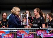24 November 2019; Eileen Lyons of Donoughmore receives the Cup from Marie Hickey, LGFA President, following the All-Ireland Ladies Junior Club Championship Final match between Donoughmore and MacHale Rovers at Duggan Park in Ballinasloe, Co Galway. Photo by Harry Murphy/Sportsfile