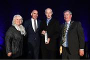 28 November 2019; Special Recognition award winner Jim Aughney is presented with his award by from left, Athletics Ireland President Georgina Drumm, Jim Dowdall, Managing Director Irish Life Health, and Councillor Tom Kitt during the Irish Life Health National Athletics Awards 2019 at Crowne Plaza Hotel, Blanchardstown, Dublin. Photo by Eóin Noonan/Sportsfile