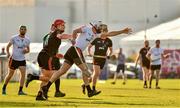 29 November 2019; Antrim's Neil McManus of 2019 PwC All-Star in action against Clare's John Conlon of 2018 PwC All-Star during the PwC All Star Hurling Tour 2019 All Star game at Zayed Sport City in Abu Dhabi, United Arab Emirates. Photo by Ray McManus/Sportsfile