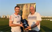 29 November 2019; Tipperary's Noel McGrath of 2019 PwC All-Star is made a presentation to by Uachtaráin Cumann Lúthchleas Gael John Horan after the PwC All Star Hurling Tour 2019 All Star game at Zayed Sport City in Abu Dhabi, United Arab Emirates.Uachtaráin Cumann Lúthchleas Gael John Horan Photo by Ray McManus/Sportsfile