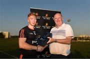 29 November 2019; Limerick's Cian Lynch of 2018 PwC All-Star team is made a presentation to by Uachtaráin Cumann Lúthchleas Gael John Horan after the PwC All Star Hurling Tour 2019 All Star game at Zayed Sport City in Abu Dhabi, United Arab Emirates.Uachtaráin Cumann Lúthchleas Gael John Horan Photo by Ray McManus/Sportsfile