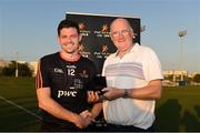 29 November 2019; Donegal's Declan Coulter of 2018 PwC All-Star is made a presentation to by Uachtaráin Cumann Lúthchleas Gael John Horan after the PwC All Star Hurling Tour 2019 All Star game at Zayed Sport City in Abu Dhabi, United Arab Emirates.Uachtaráin Cumann Lúthchleas Gael John Horan Photo by Ray McManus/Sportsfile