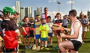 29 November 2019; Donegal's Declan Coulter of 2018 PwC All-Star team with local children during a coaching session before the PwC All Star Hurling Tour 2019 All Star game at Zayed Sport City in Abu Dhabi, United Arab Emirates. Photo by Ray McManus/Sportsfile